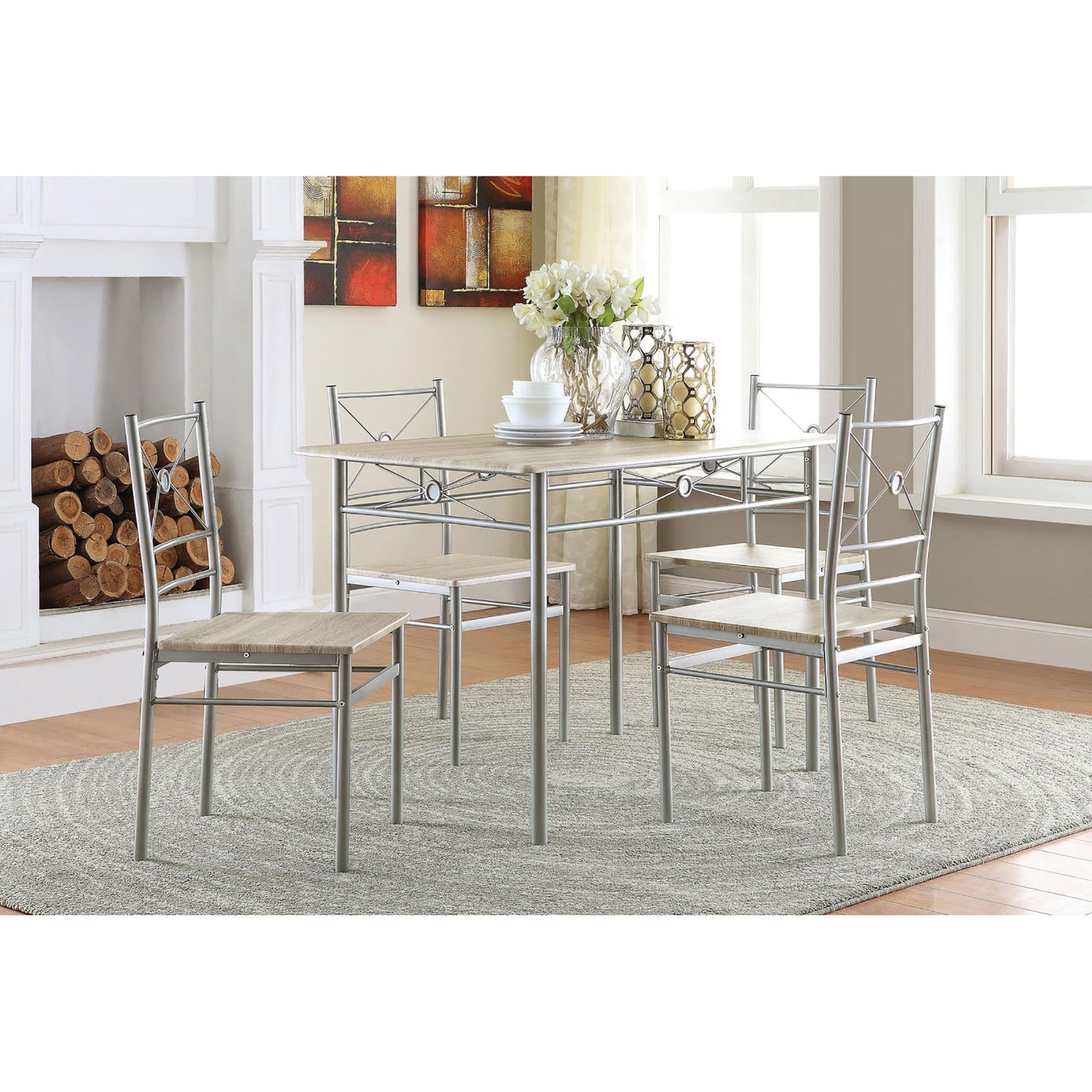 Modern dining set with four silver metal chairs and a light wood grain tabletop perfect for small kitchens