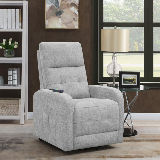 Light gray upholstered power recliner with side pocket and remote control