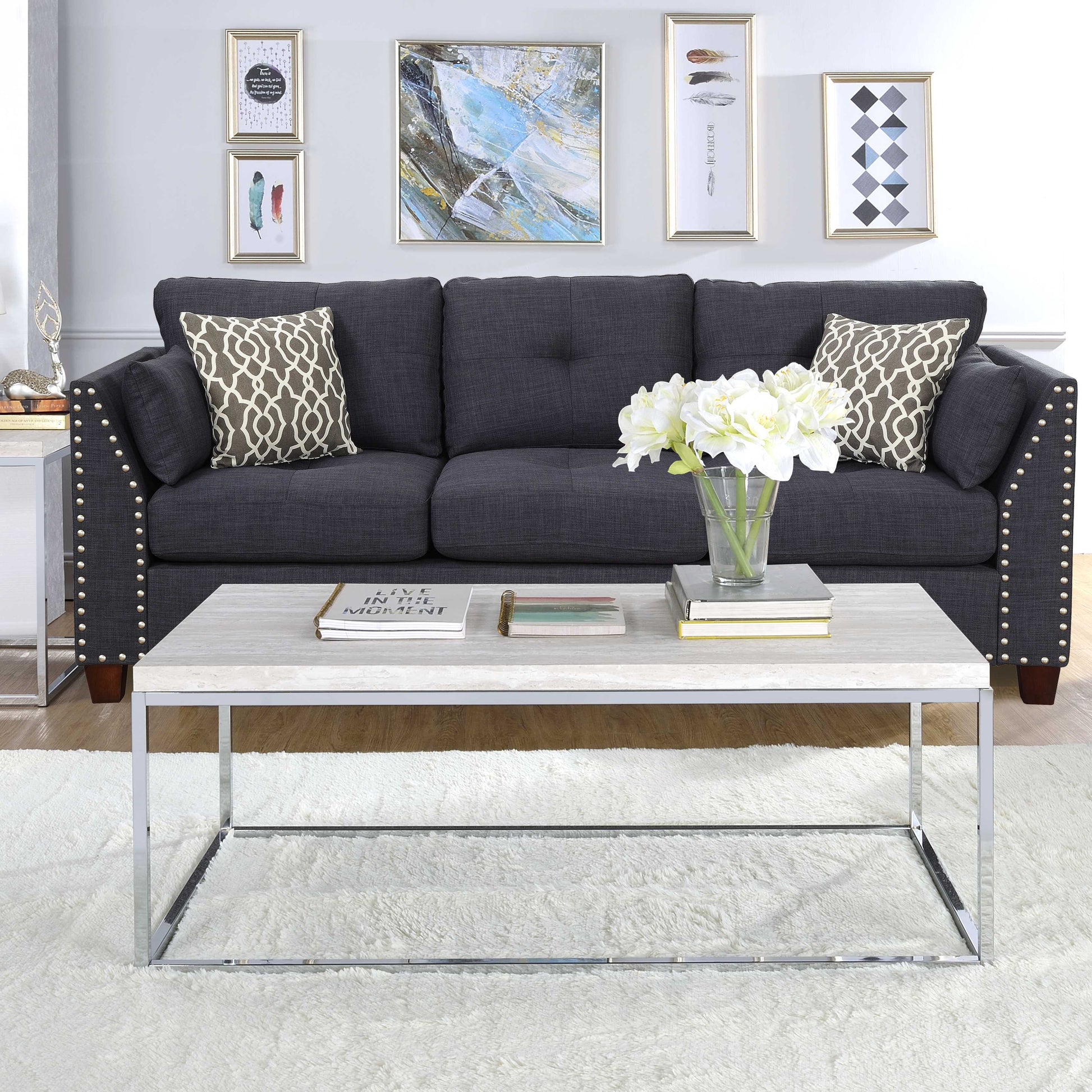 Dark gray linenlook sofa with tufted back and decorative nailhead trim