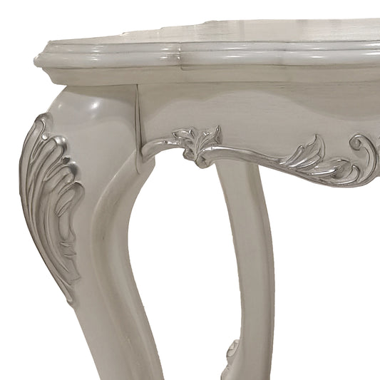 Elegant ornate white console table detail with silver accents