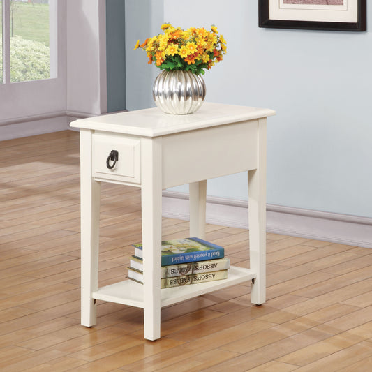 Cream end table with drawer and open shelf holding books
