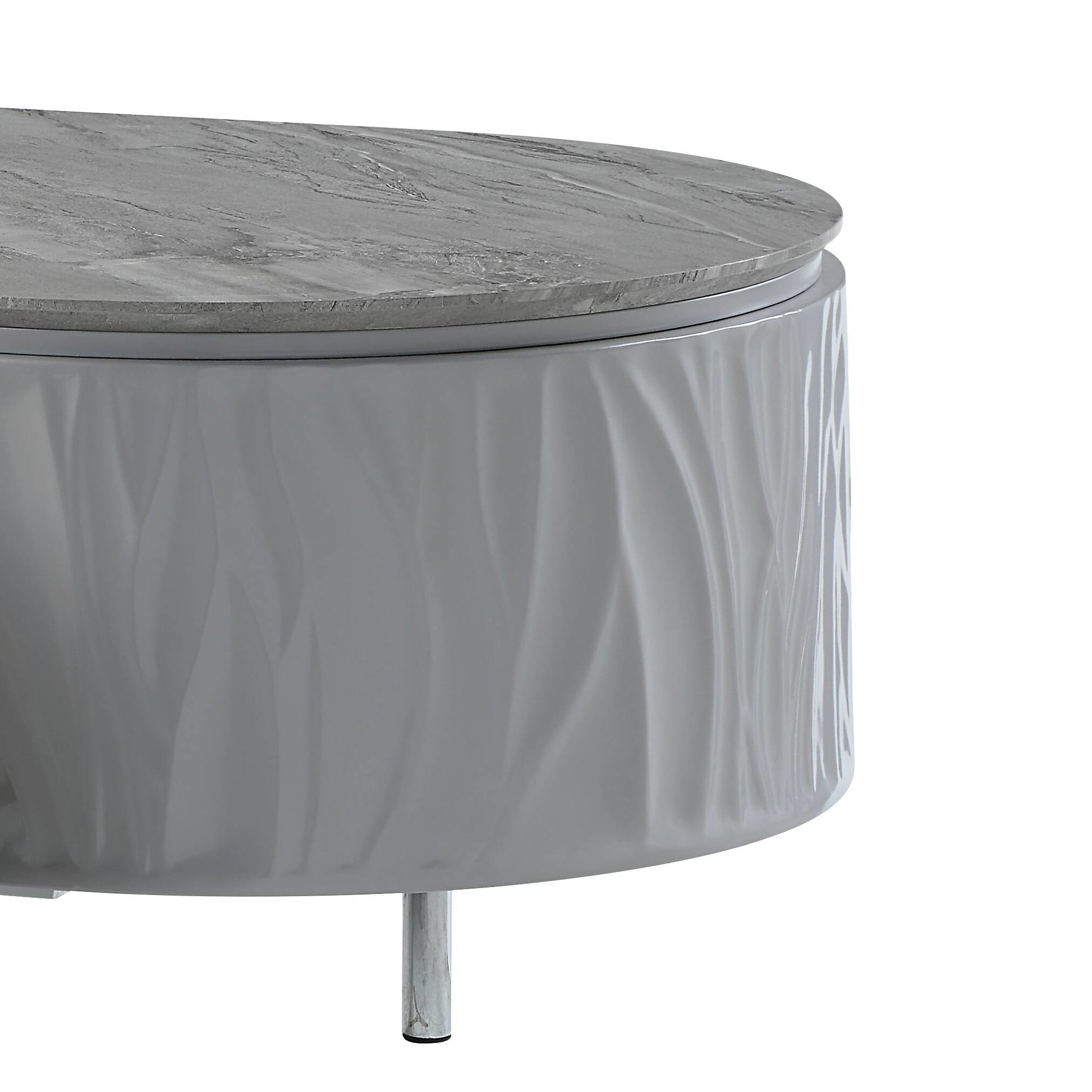 Round grey coffee table with textured base and marblelook top