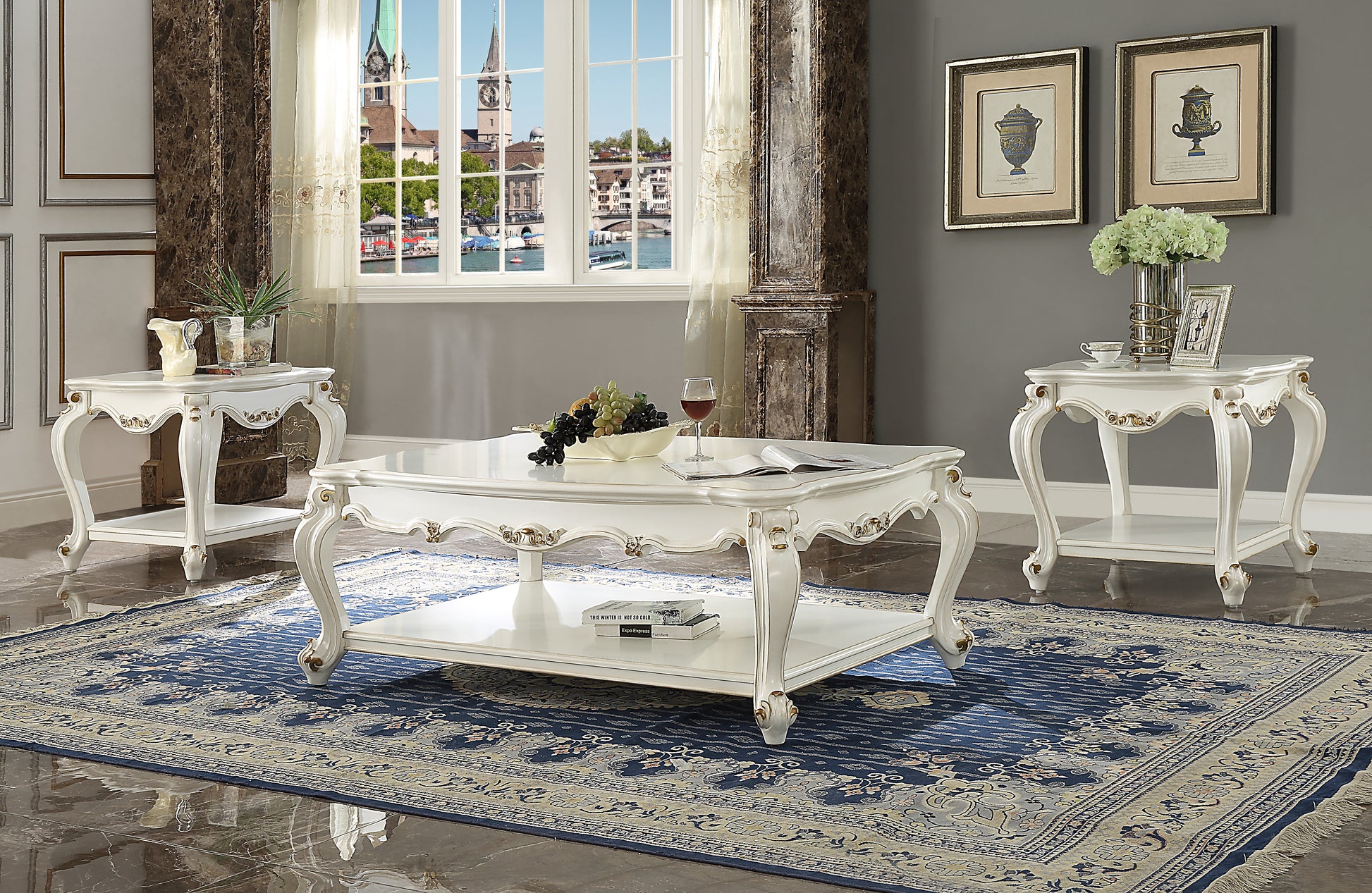 White ornate coffee table with gold accents and decorative legs