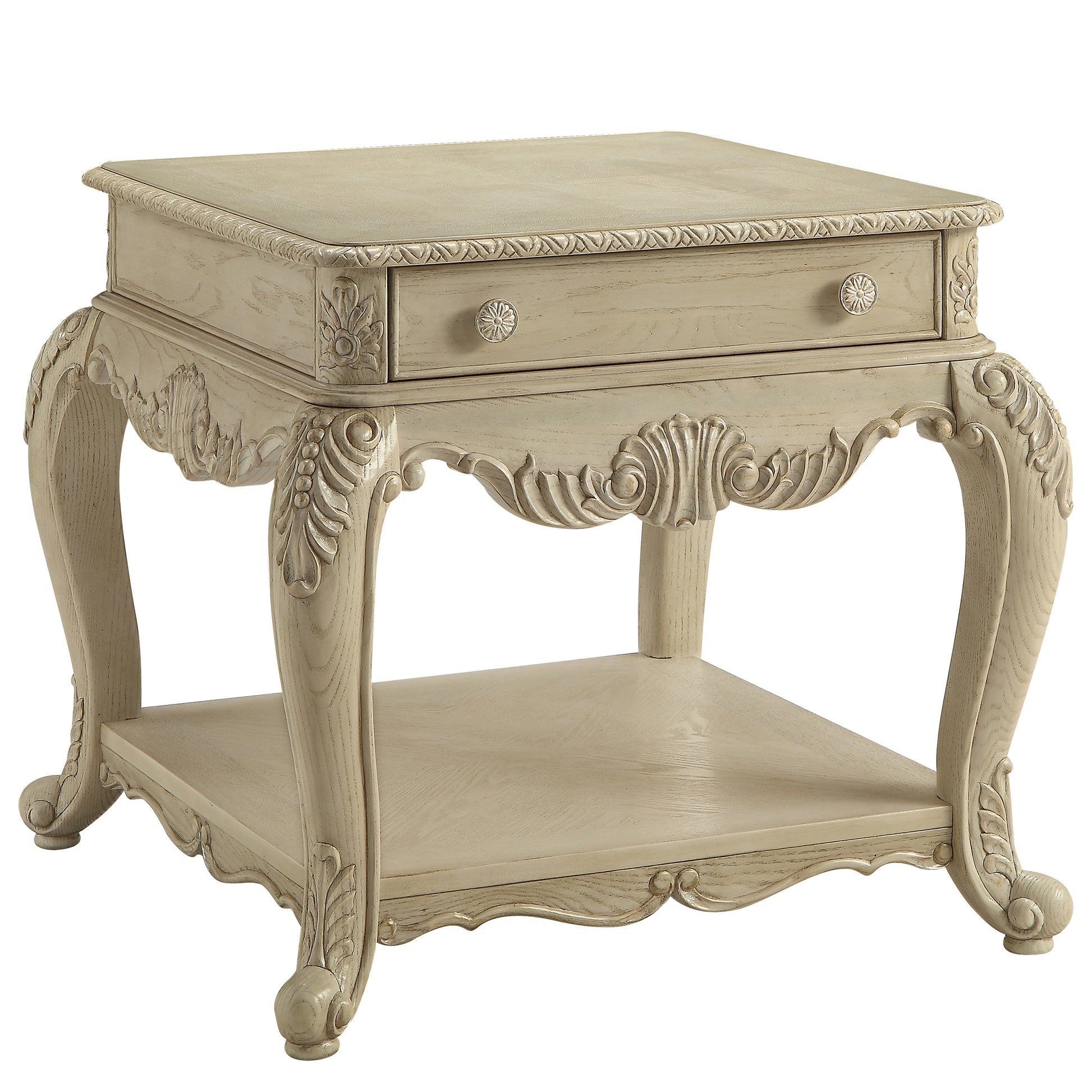 Elegant antique white end table with ornate carved details and single drawer