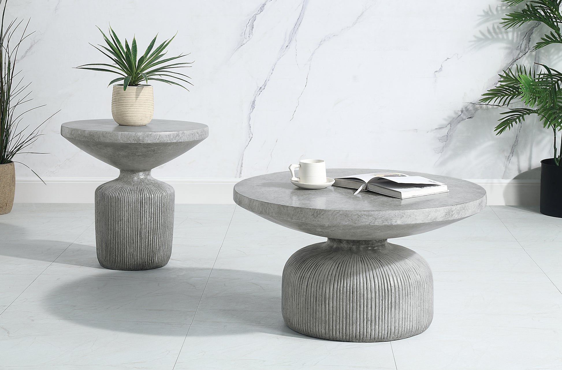 Round concrete coffee table with fluted base and open book