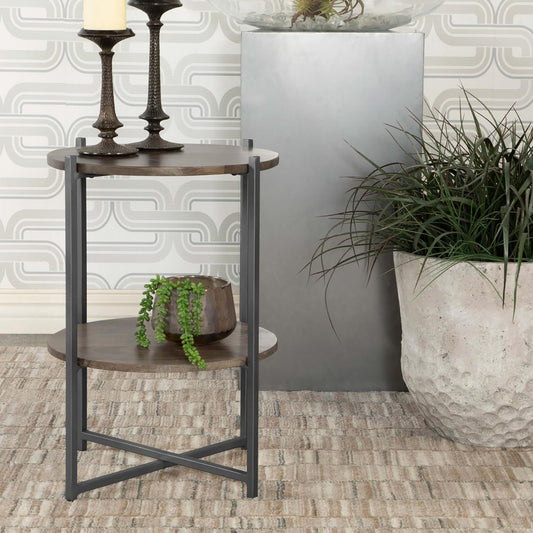 Round wood end table with dark metal frame and two shelves showcasing a modern farmhouse style