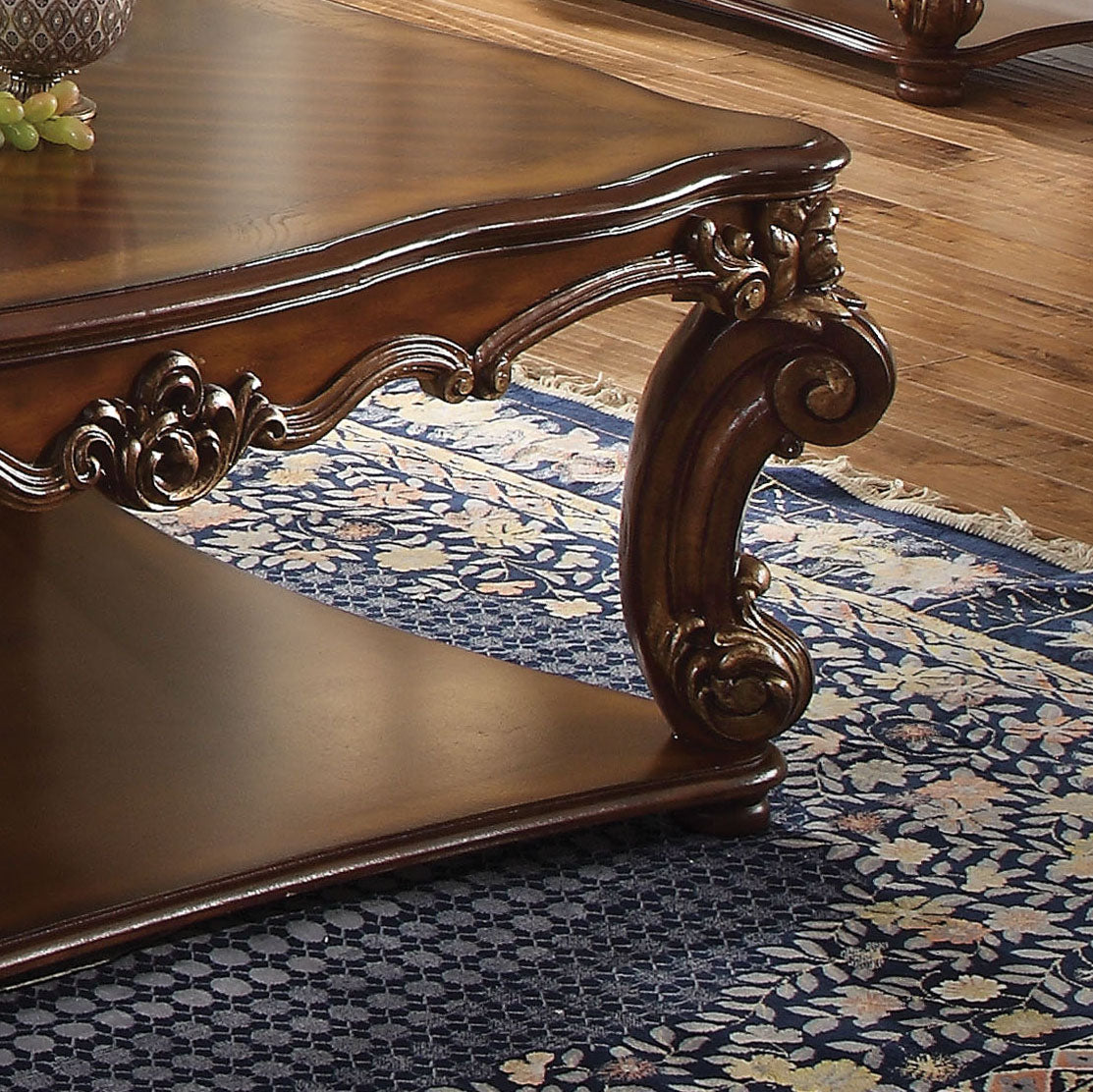 Ornate carved wooden coffee table leg with intricate scrolling detail
