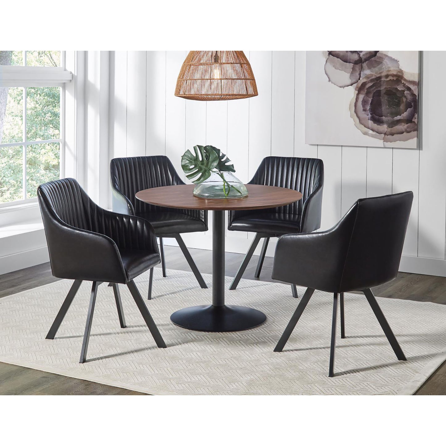 Black upholstered dining chairs with channel tufting and modern dining table set
