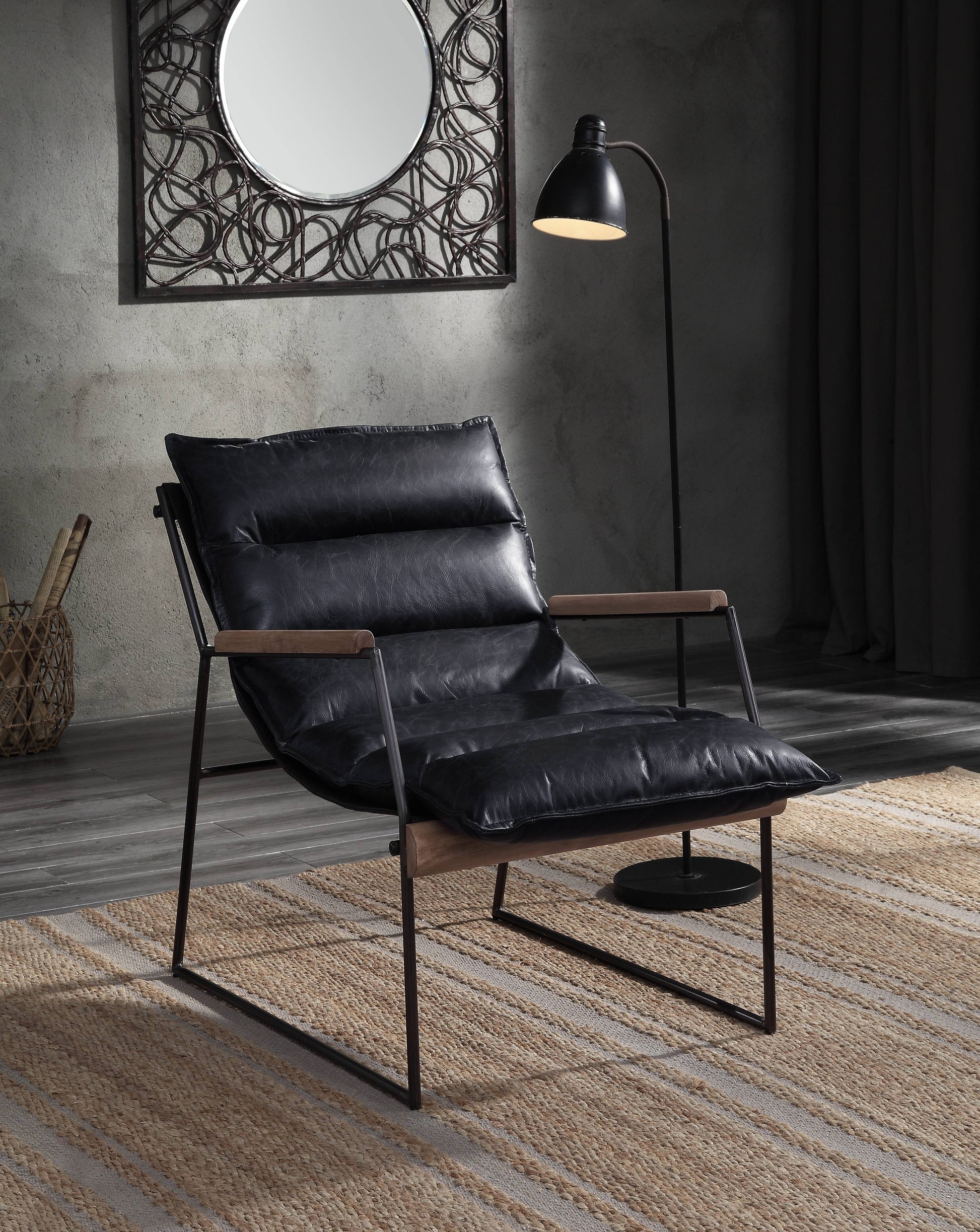 Comfortable black leather accent chair with a modern metal frame and wooden armrests