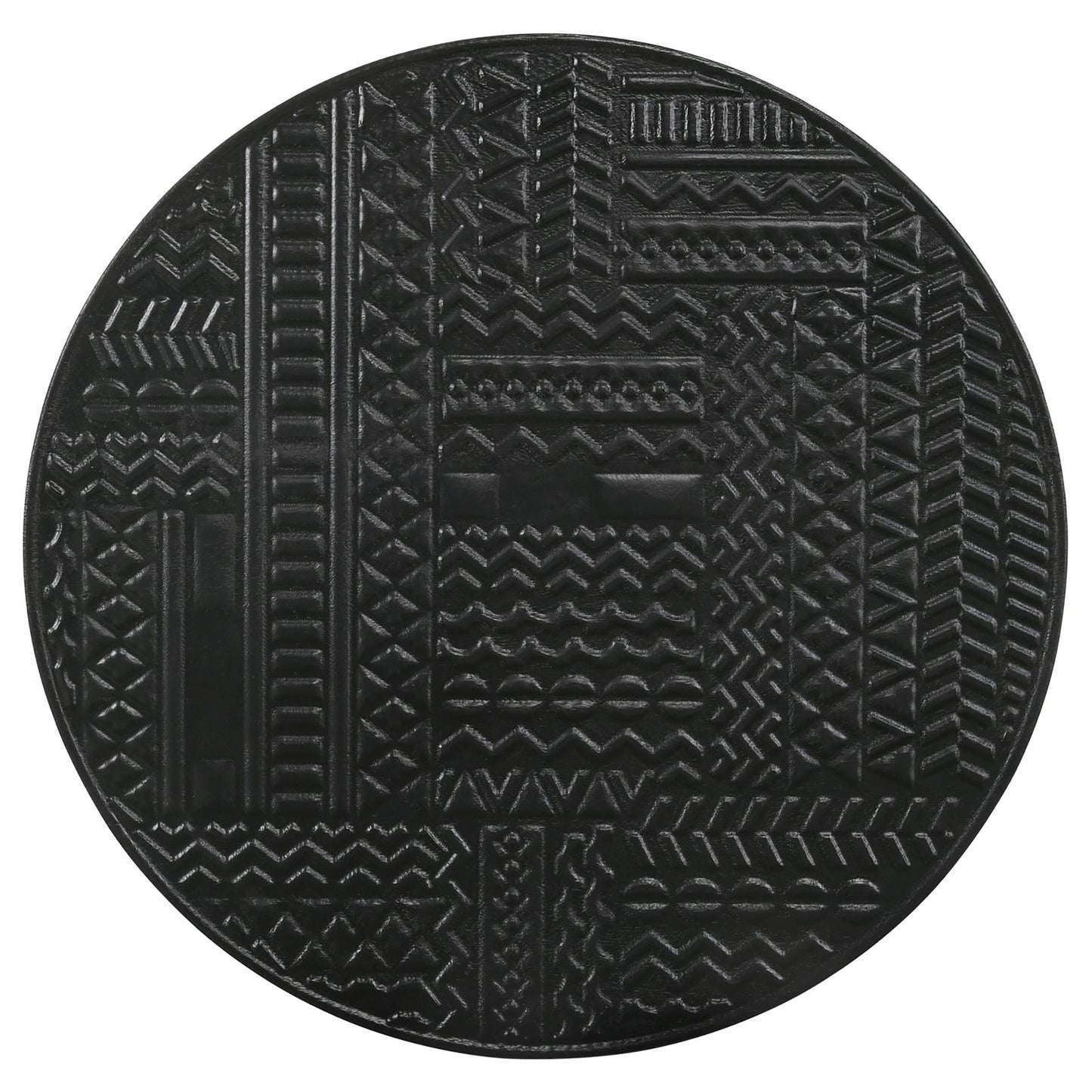 Black circular coaster with embossed geometric tribal patterns and intricate textures