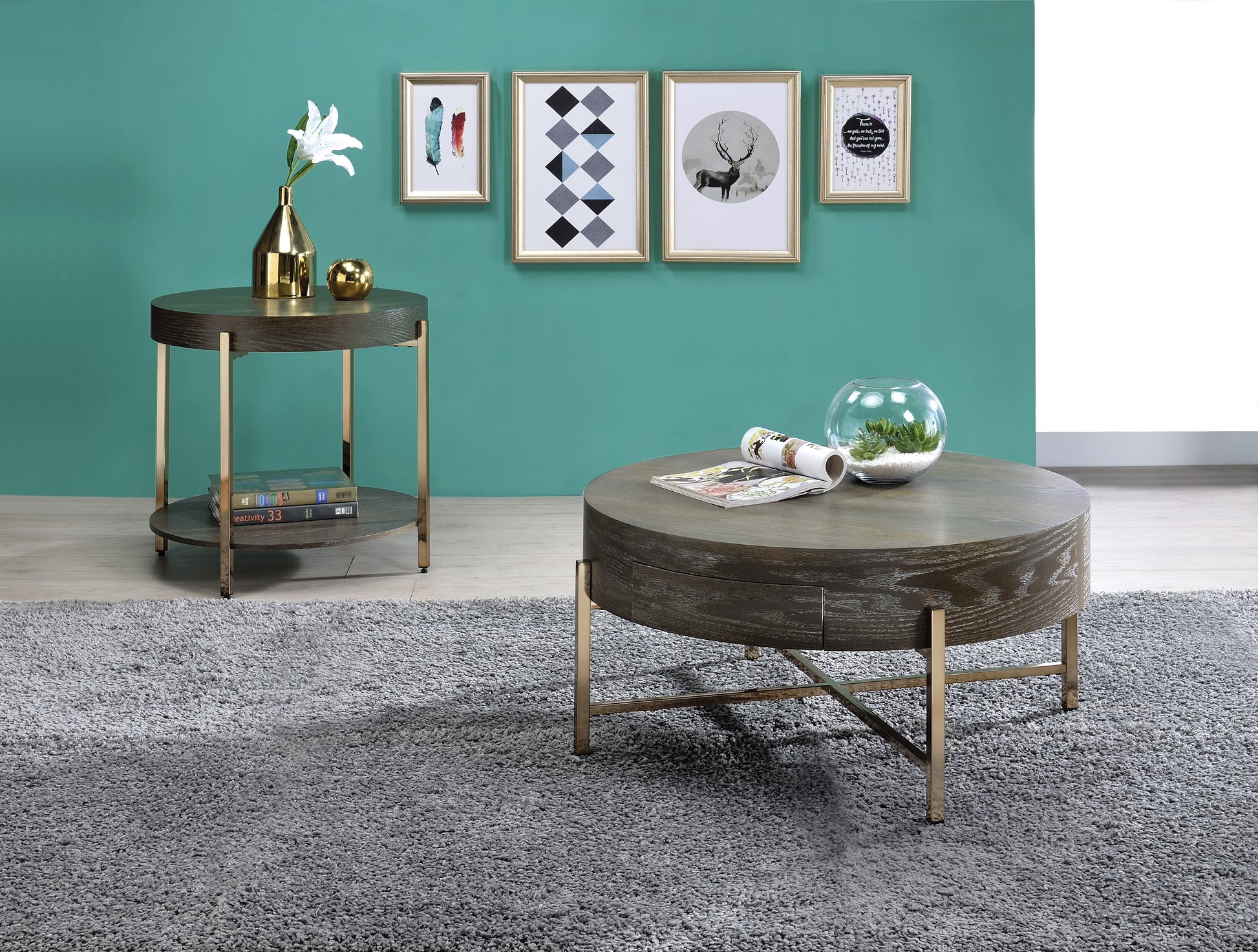 Dark wood round coffee table with gold legs featuring a glass terrarium with succulents