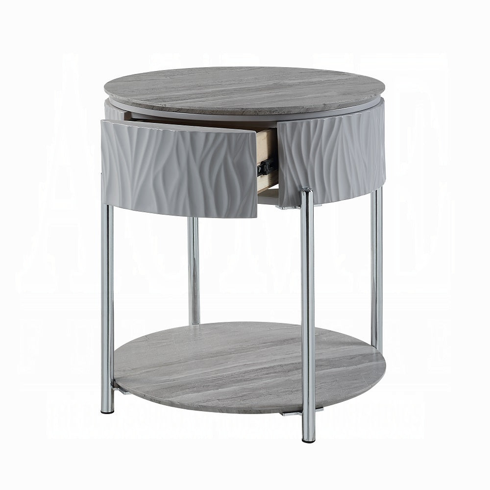 Round gray bedside table with textured drawer and stonelook top
