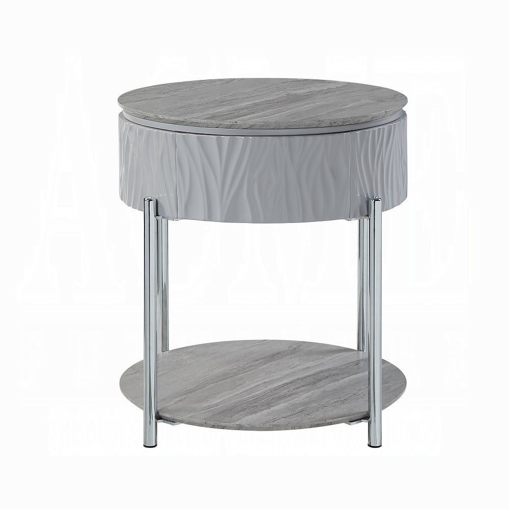 Modern grey marble top round accent table with white wavy textured base and chrome legs