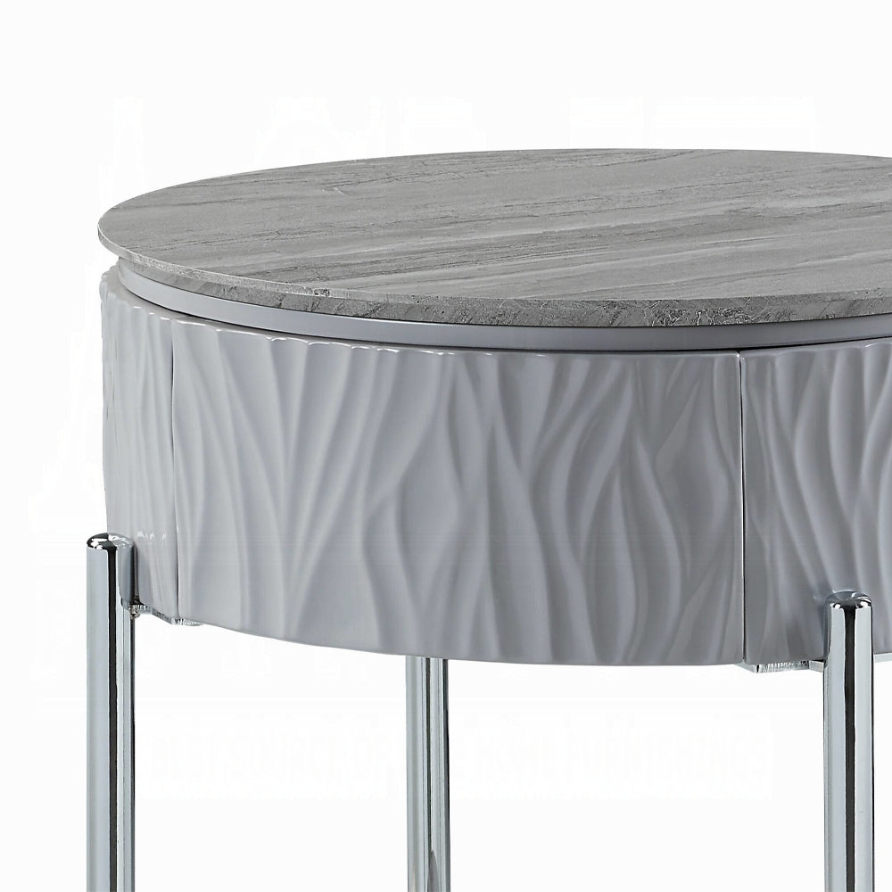 Round gray marble top side table with textured white base and chrome legs