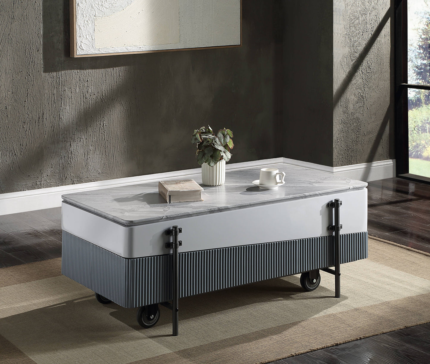 Modern white coffee table with grey marble top and fluted base