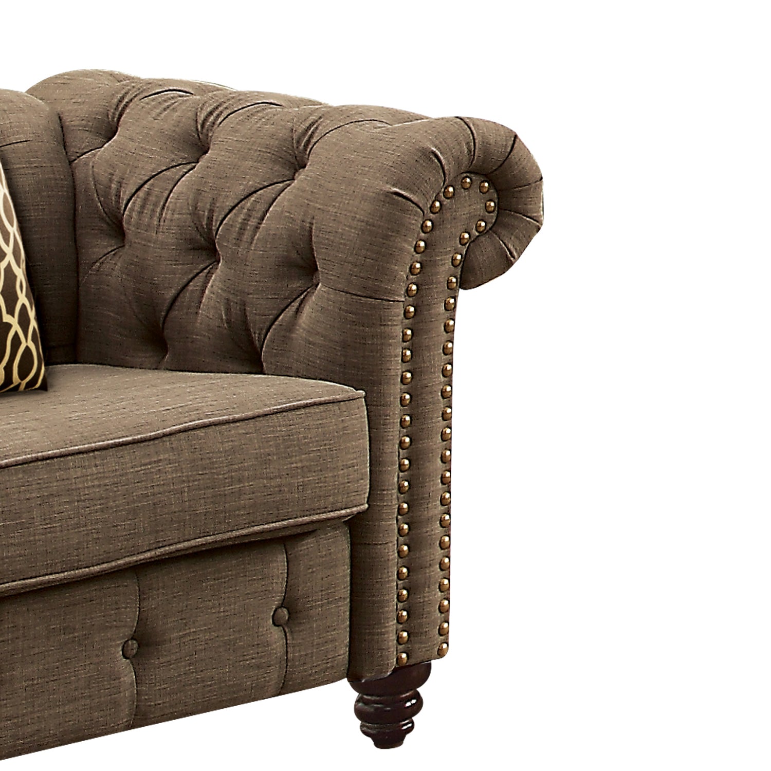 Brown tufted chesterfield sofa arm with ornate nailhead trim and decorative legs