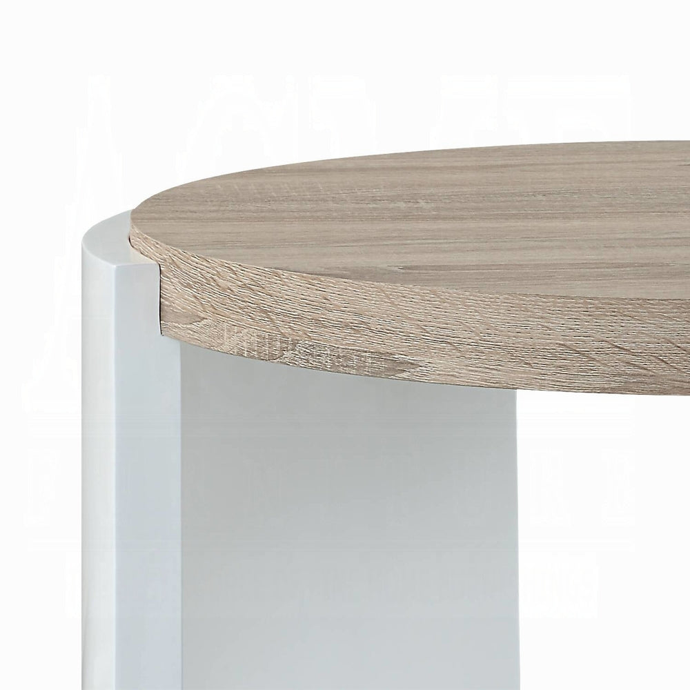 Closeup of a round light oak wood tabletop with a white pedestal base