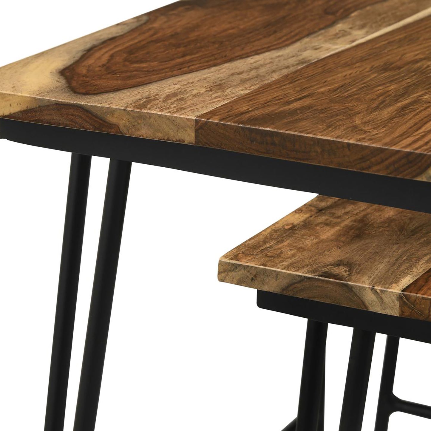 Closeup of a modern coffee table with a rustic wood top and black metal legs
