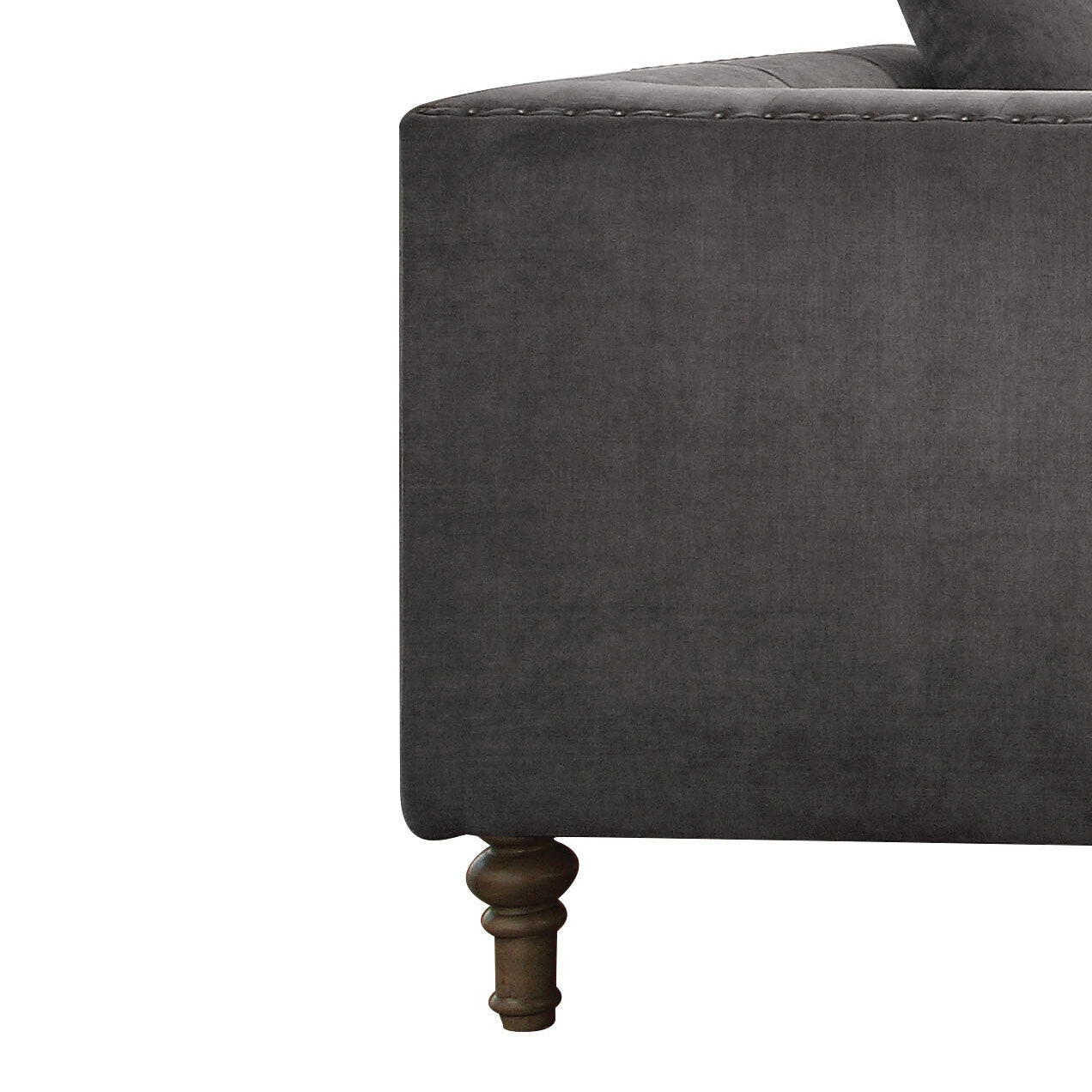 Dark gray velvet tufted armchair side view with wooden cabriole leg