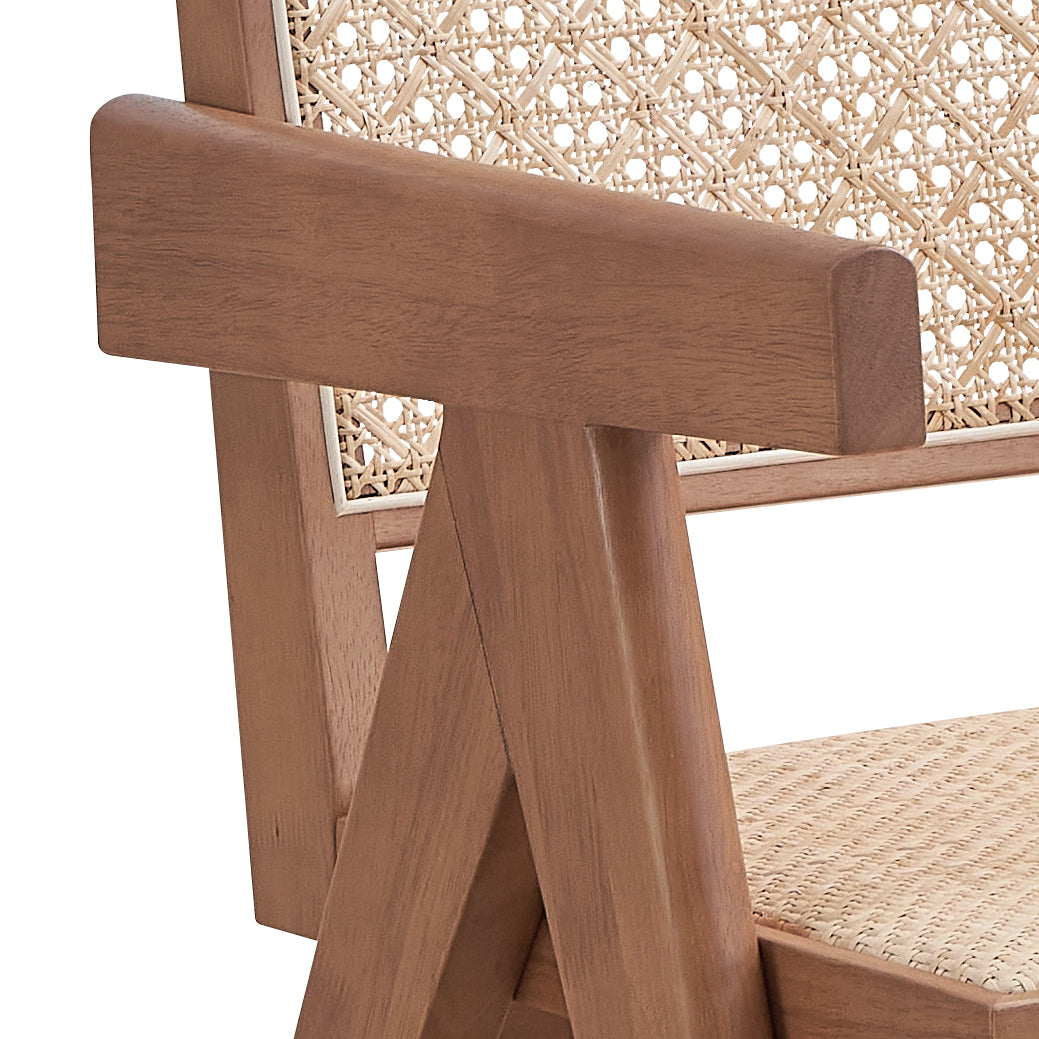 Wooden armchair with intricate woven cane back detail and natural wood frame