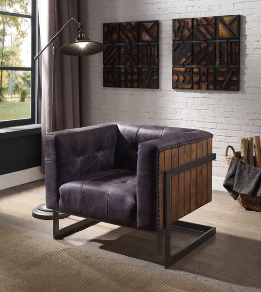 Dark gray leather accent chair with wood paneling and metal frame