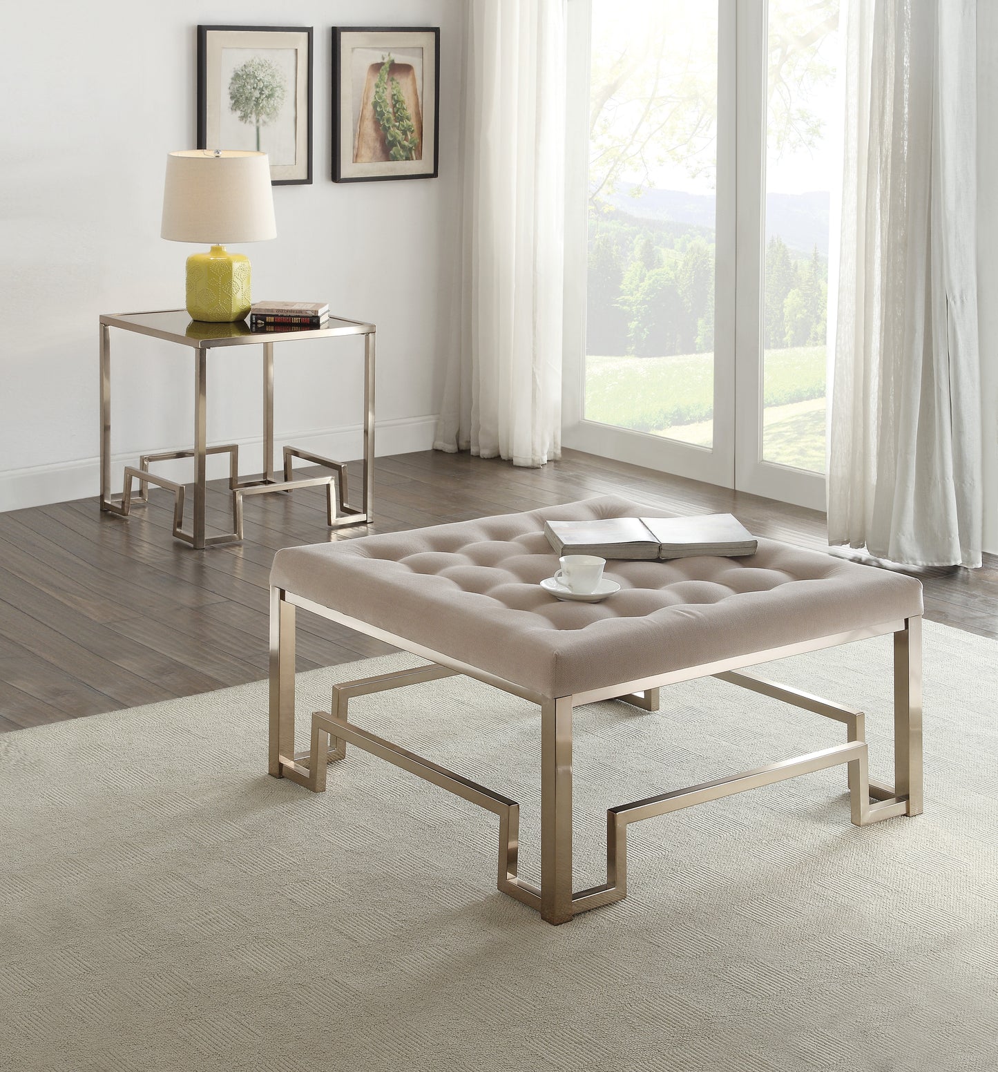 Tufted beige linen ottoman with modern gold metal base a stylish living room accent piece