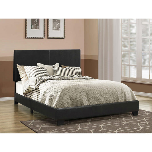 Modern black faux leather platform bed frame with upholstered headboard and textured bedding