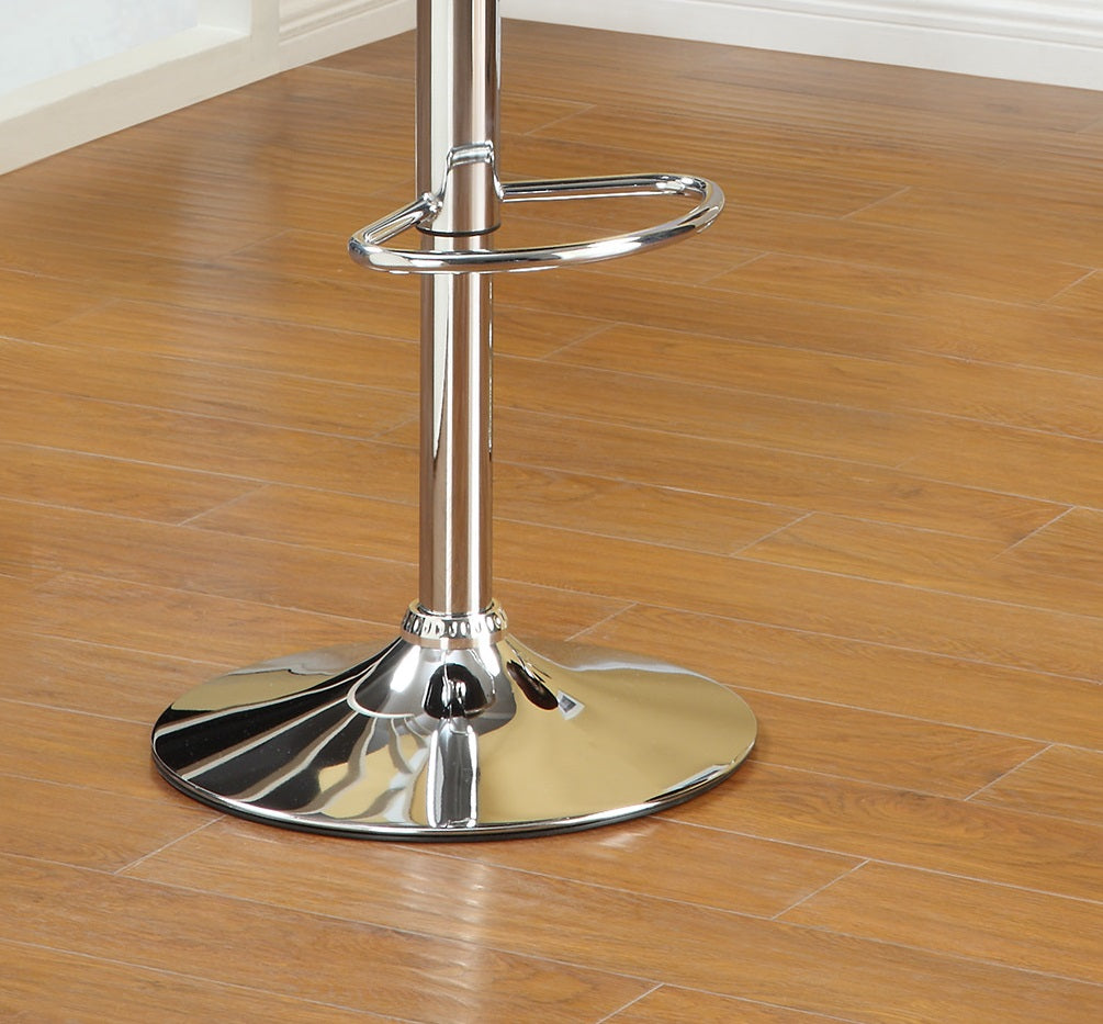 Chrome adjustable stool base and footrest on wooden floor