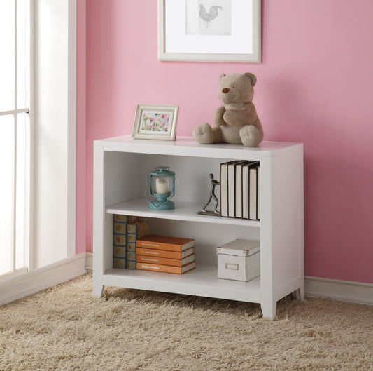 White wooden bookshelf with two shelves holding books a lantern and decorative items