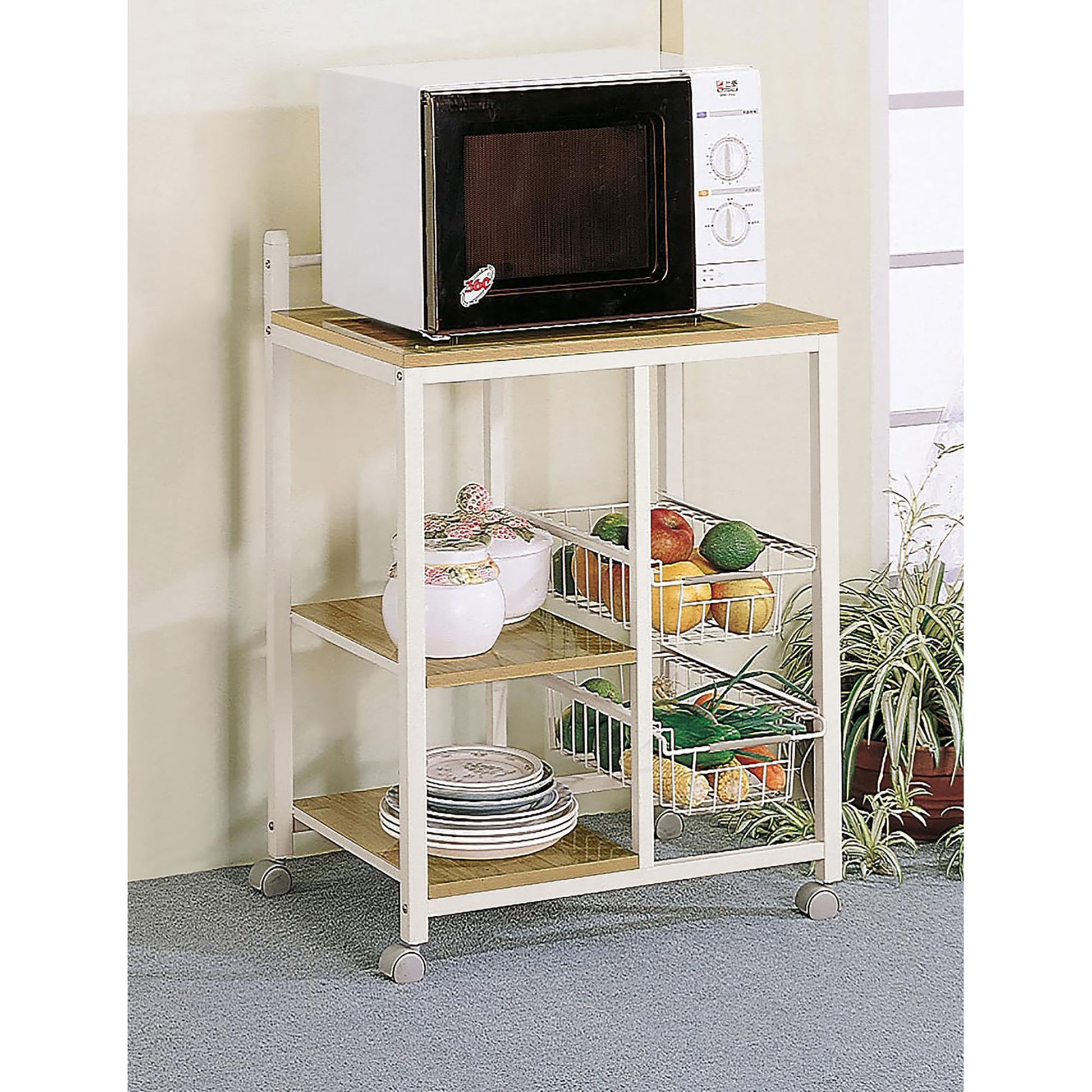 White microwave oven with digital display on a rolling kitchen cart