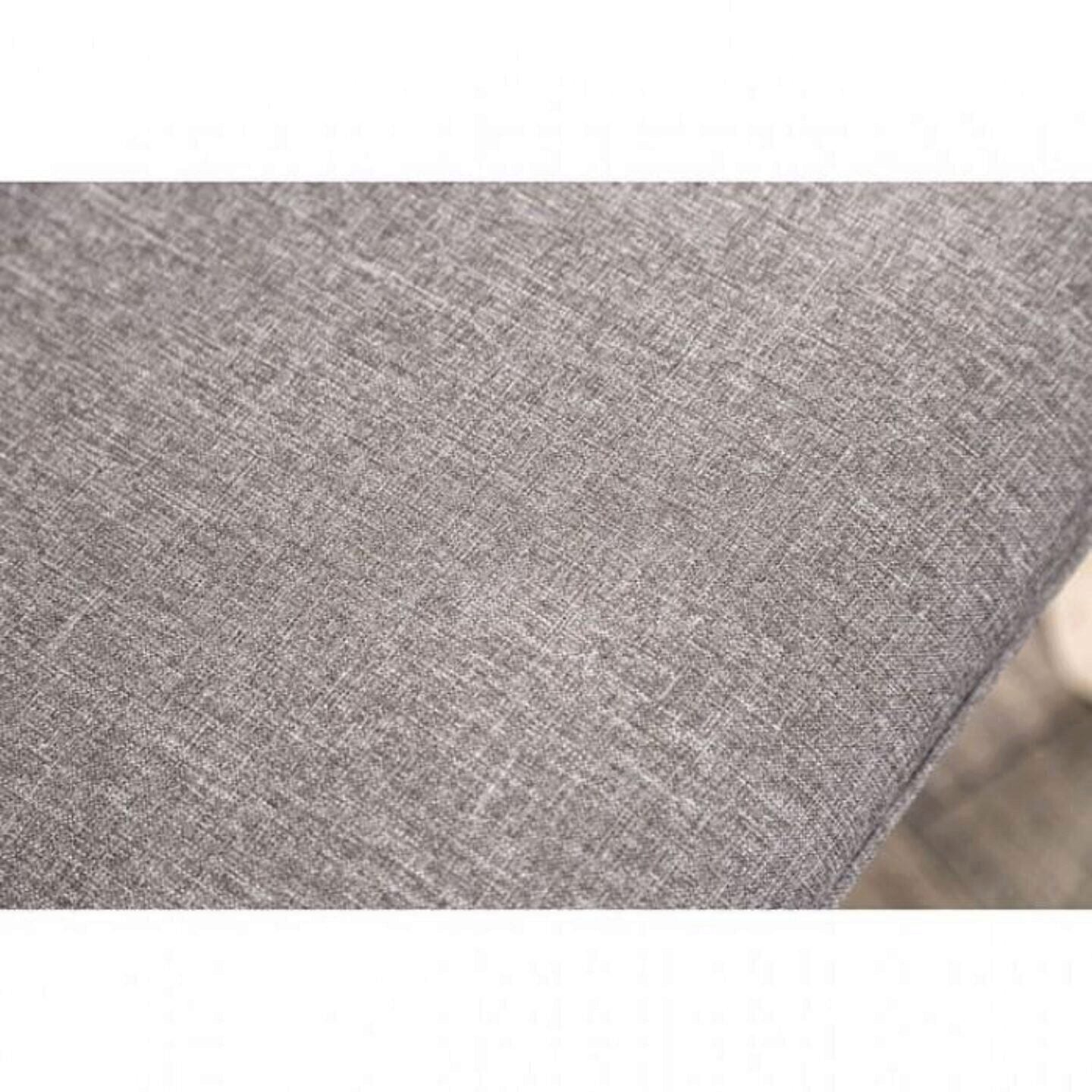 Closeup of textured grey fabric upholstery for a sofa showing detailed weave