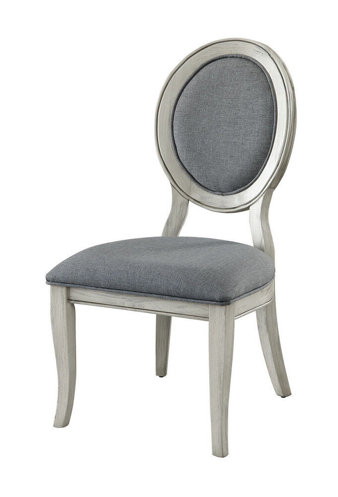Grey upholstered oval back chair with distressed white frame