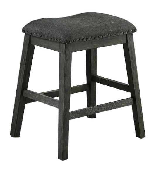 Dark gray upholstered counter stool with studded trim and a distressed wood base