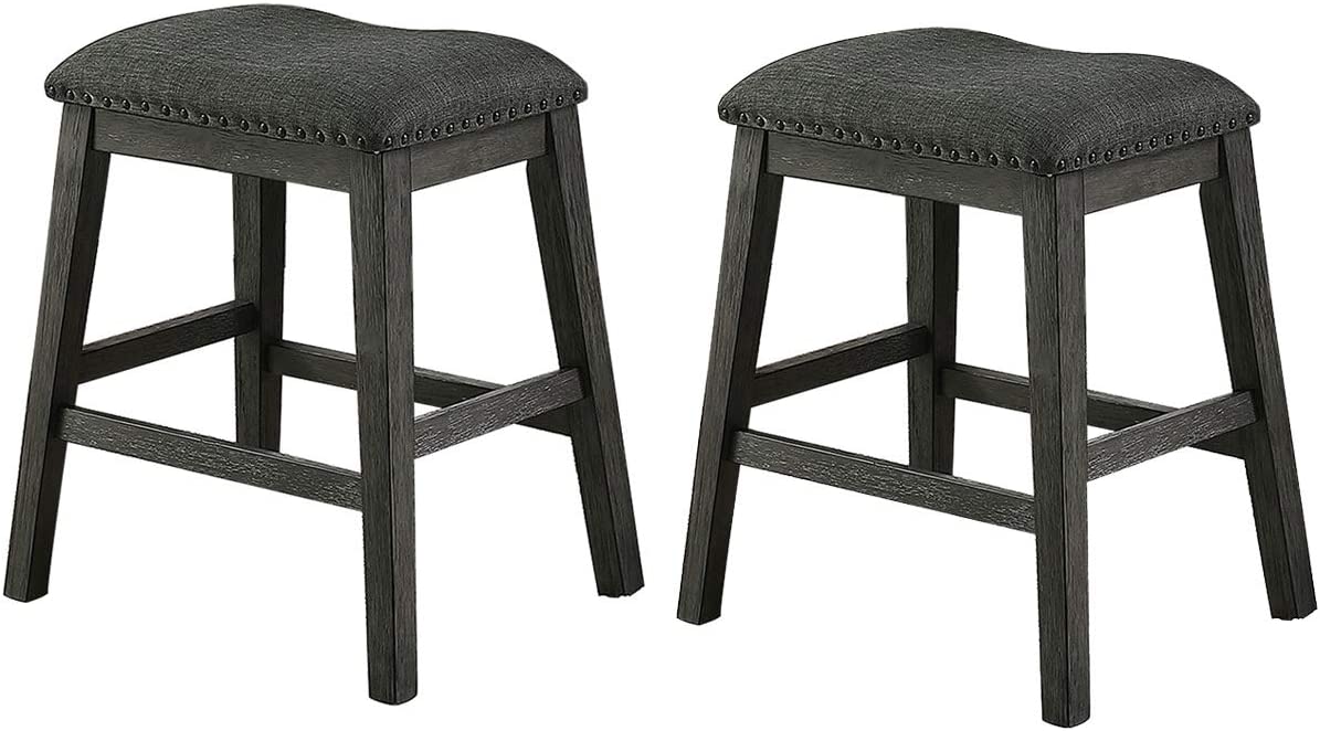 Two charcoal grey upholstered counter stools with dark wood legs and nailhead trim