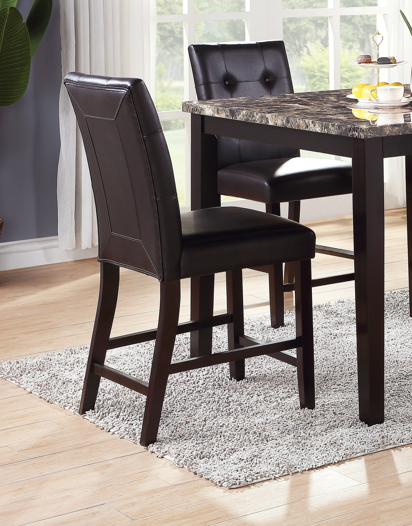 Dark brown faux leather bar stool with stitched detailing and wood legs
