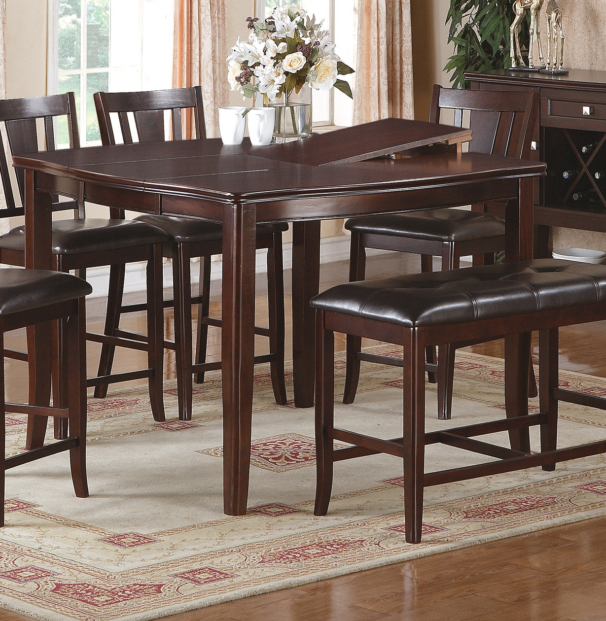 Dark wood extendable dining table with upholstered bar stools and bench seating