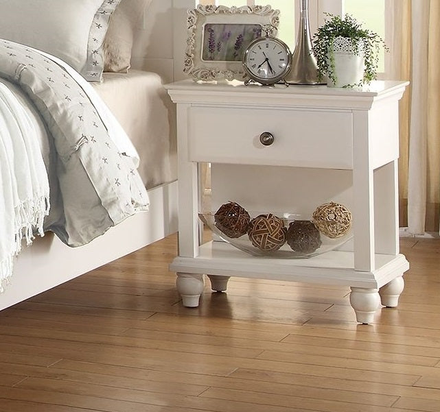 Classic white nightstand with ornate drawer pull perfect for bedroom storage