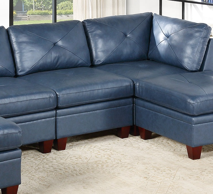 Navy blue leather sectional sofa with diamondstitched back cushions and wooden legs