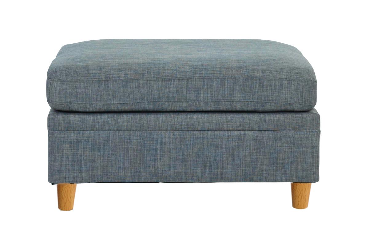 Blue upholstered storage ottoman with wooden legs and textured fabric