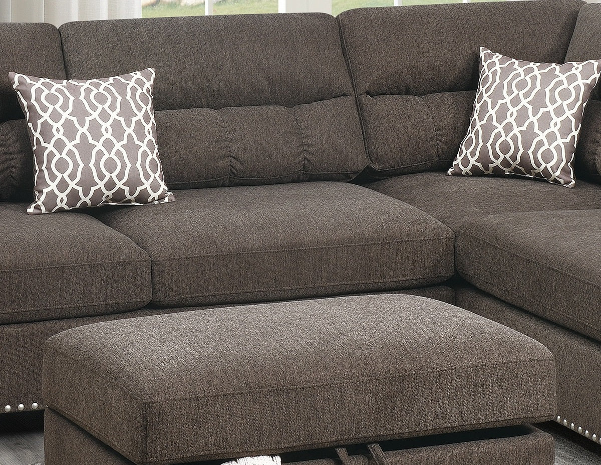 Textured charcoal sectional sofa with patterned throw pillows