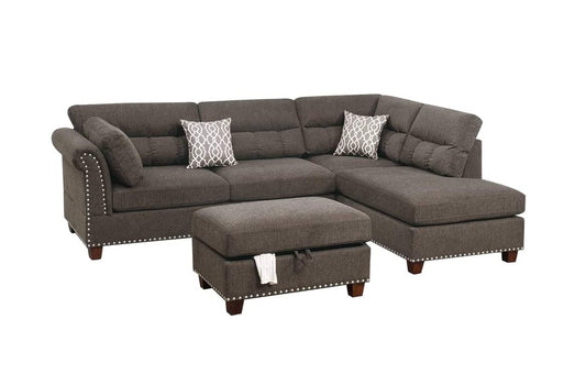 Dark gray fabric sectional sofa with tufted back cushions and silver nailhead trim