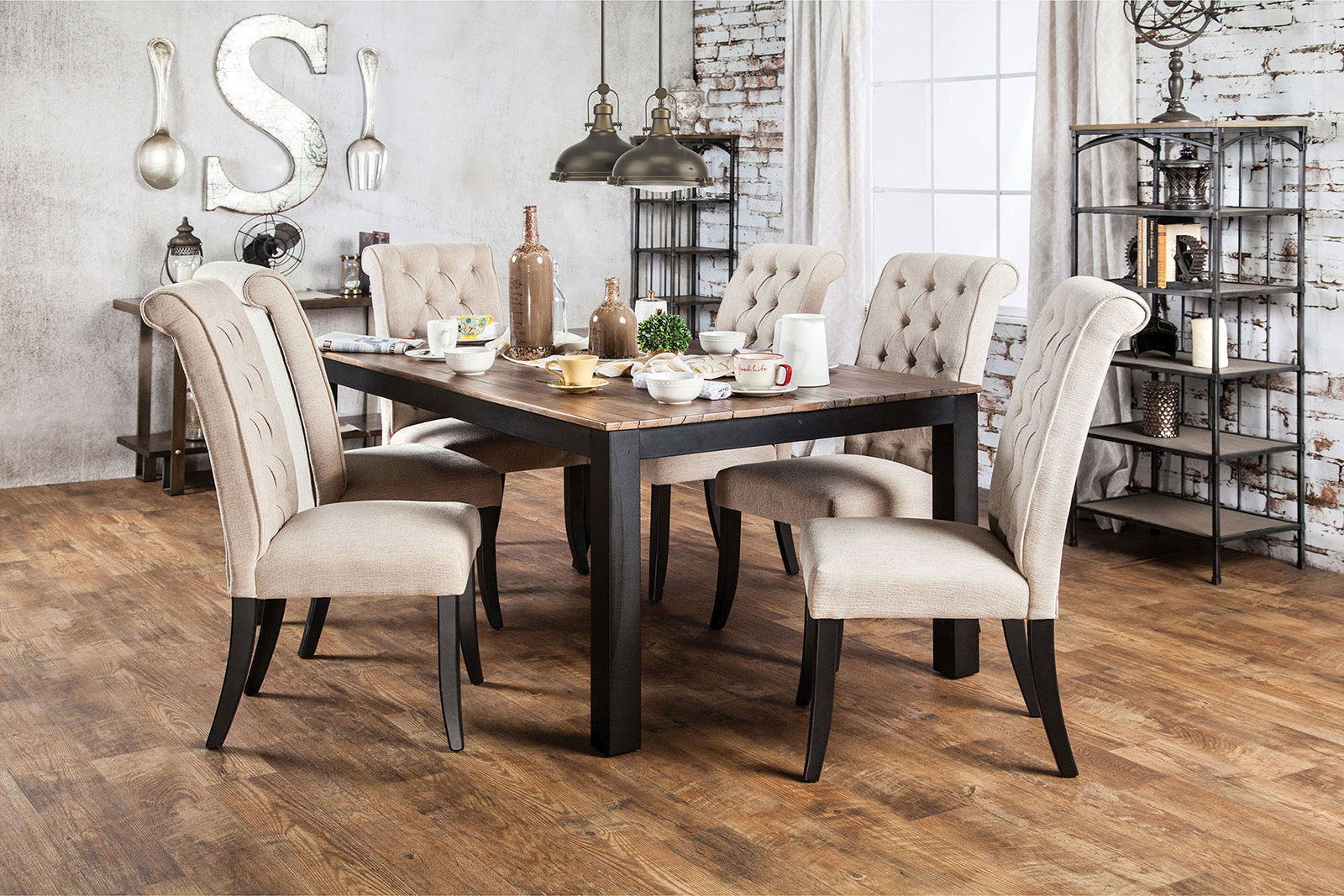 Tufted dining chairs in beige fabric arranged around a rustic wooden dining table