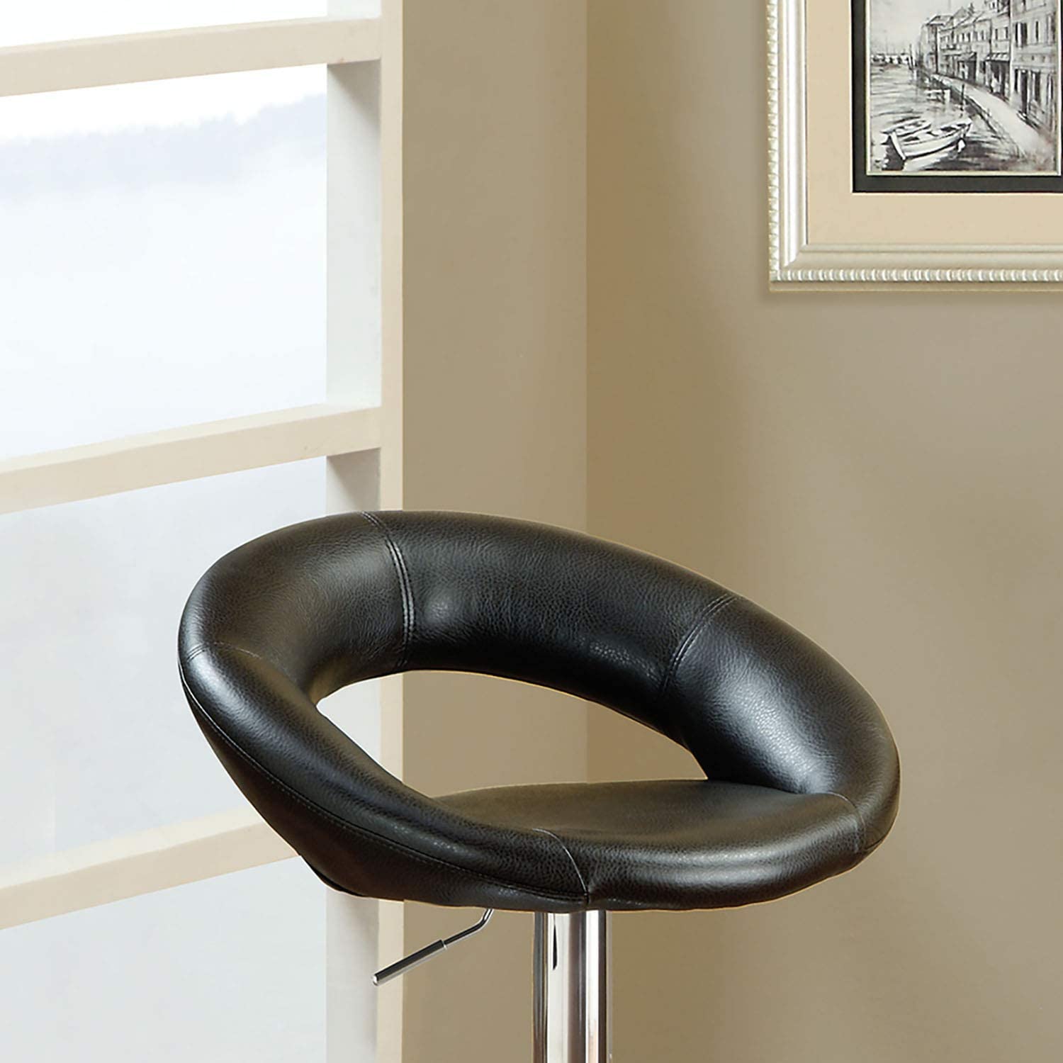 Black leather bar stool with chrome base a stylish addition to any modern kitchen