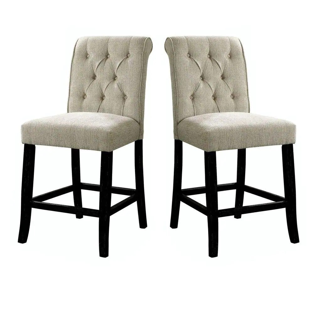 Two beige upholstered tufted counter stools with dark wood legs perfect for a kitchen island