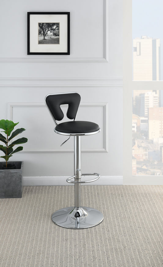 Black faux leather adjustable bar stool with chrome base and footrest