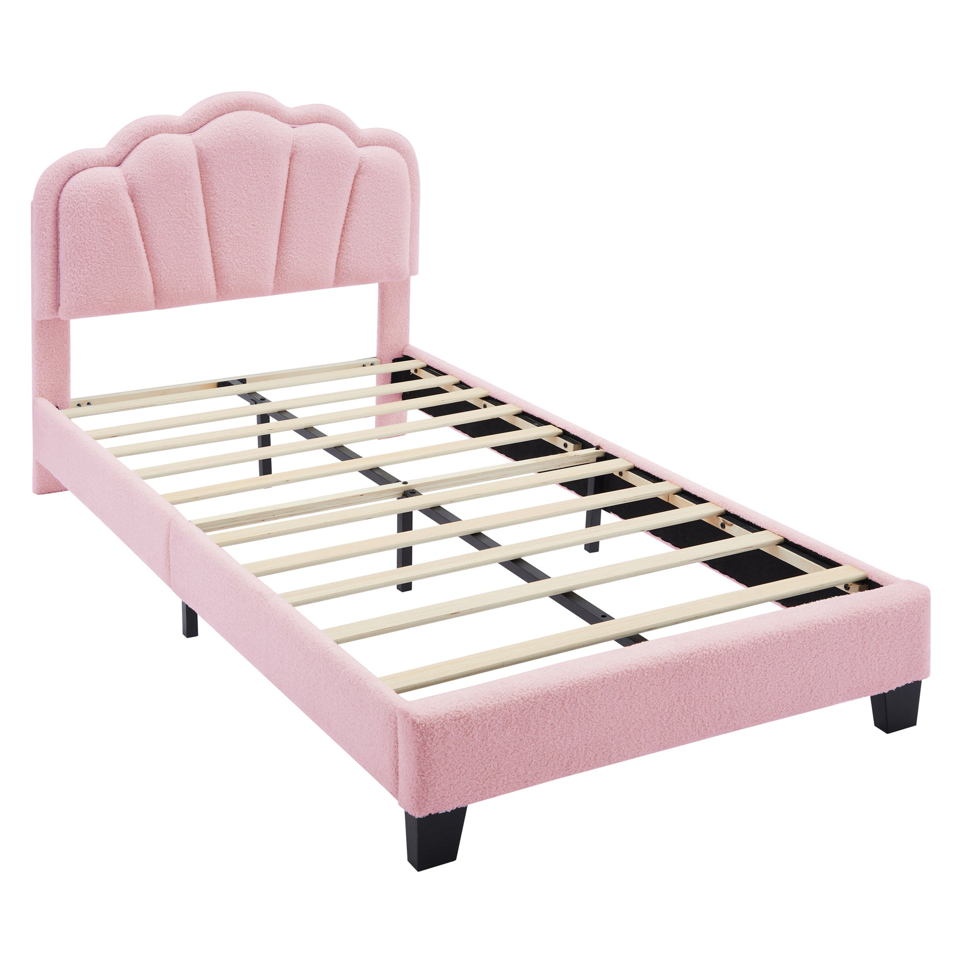 Pink upholstered twin bed frame with scalloped headboard