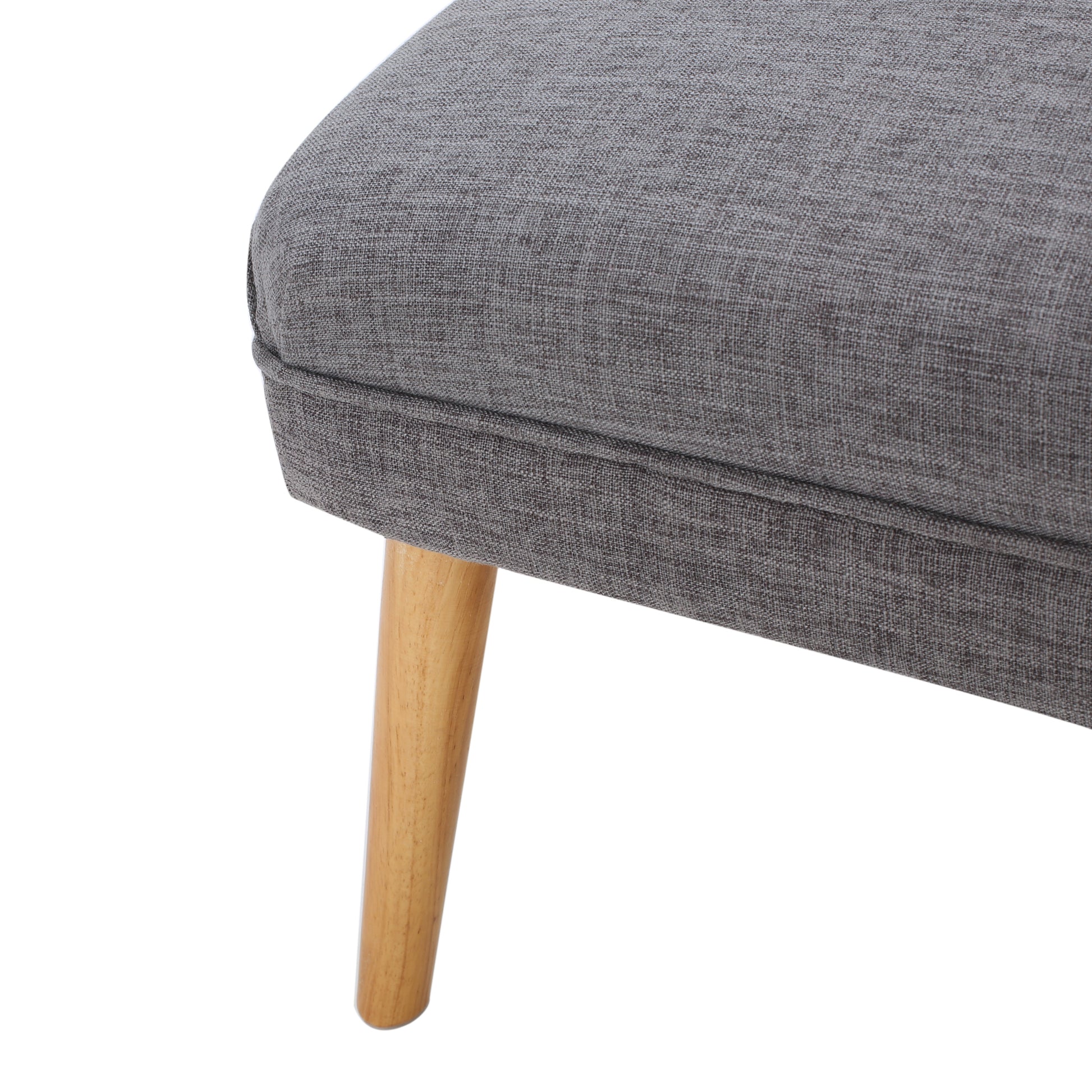 Textured grey fabric armchair corner with angled wooden leg