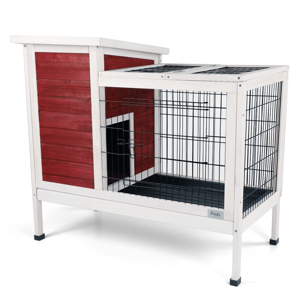 Wooden rabbit hutch with red side white trim and wire enclosure