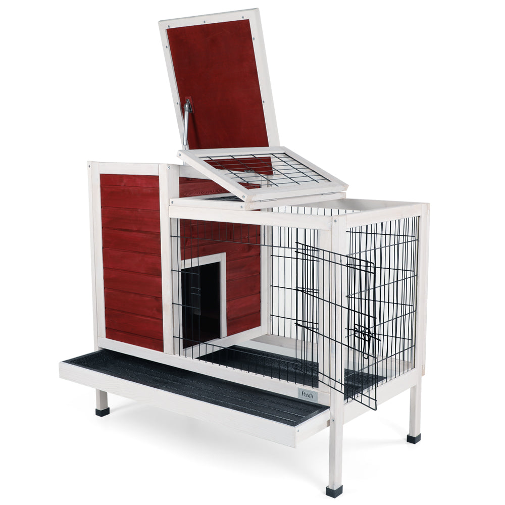 Twotier red wooden rabbit hutch with open wire top and black ramp for outdoor use
