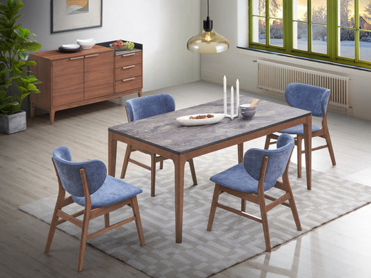 Modern dining set with gray marble top table and four blue velvet chairs